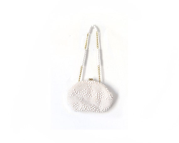 small white pocketbook