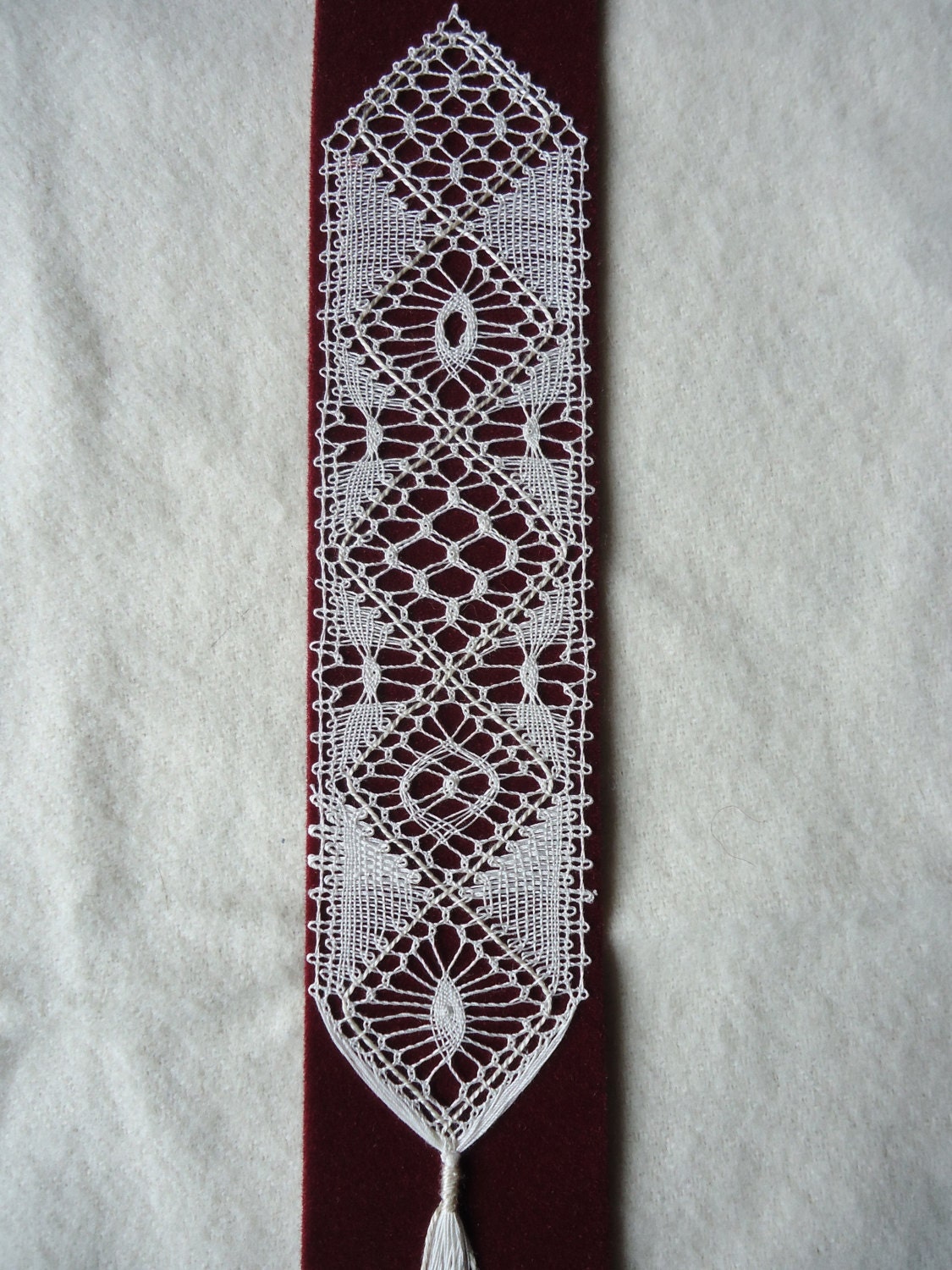 Handmade bobbin lace bookmark using the traditional torchon