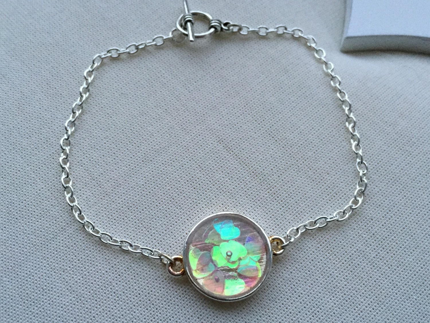 Opalescent iridescent hearts bracelet on silver; pink, green, purple, blue oily rainbow