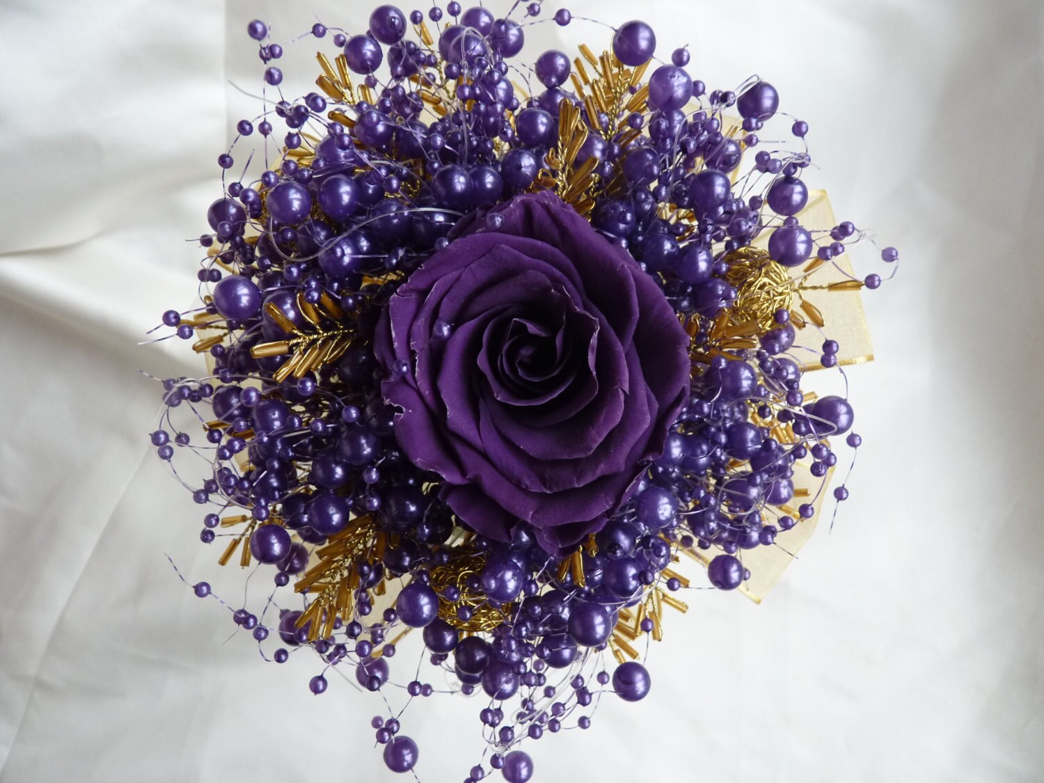 Purple and gold preserved rose bridesmaids bouquet with purple