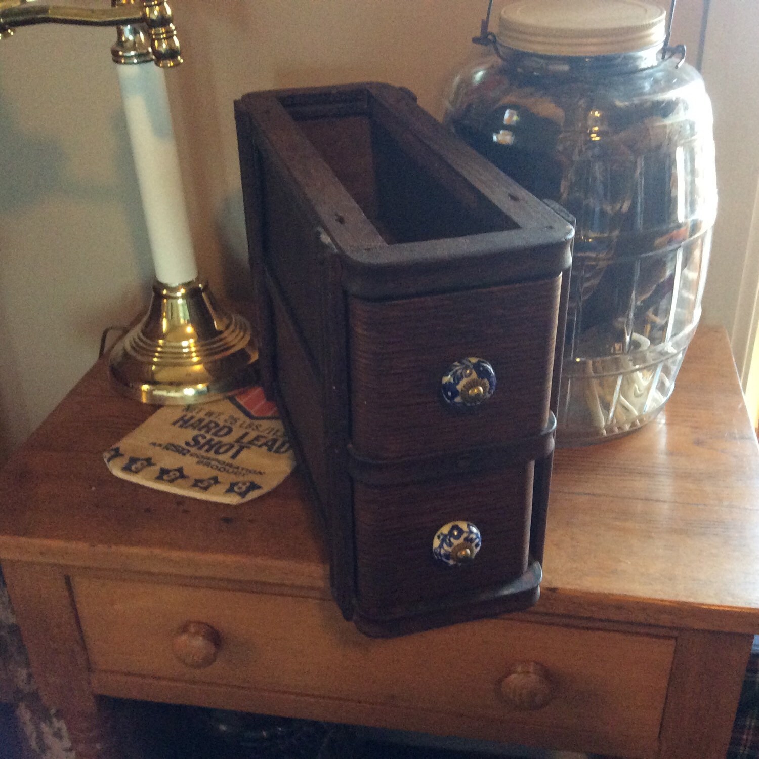 Singer sewing machine oak drawers in wooden frame with glass knobs