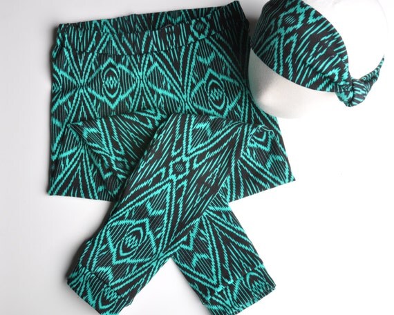 Toddler tribal leggings The stretch knit leggings feel comfortable and give a fun pop with the tribal print. Set: Shirt, vest and leggings Shirt: Scoop neck, long sleeves, snap-button back closure, sheer ruffle hem.