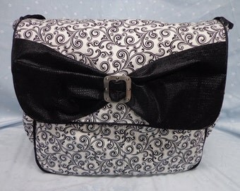 green and black diaper bag