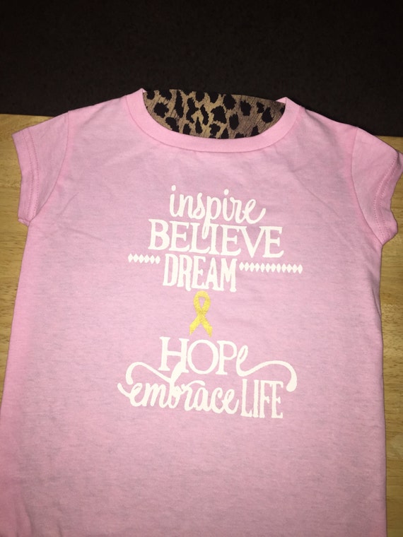 black shirt pink writing