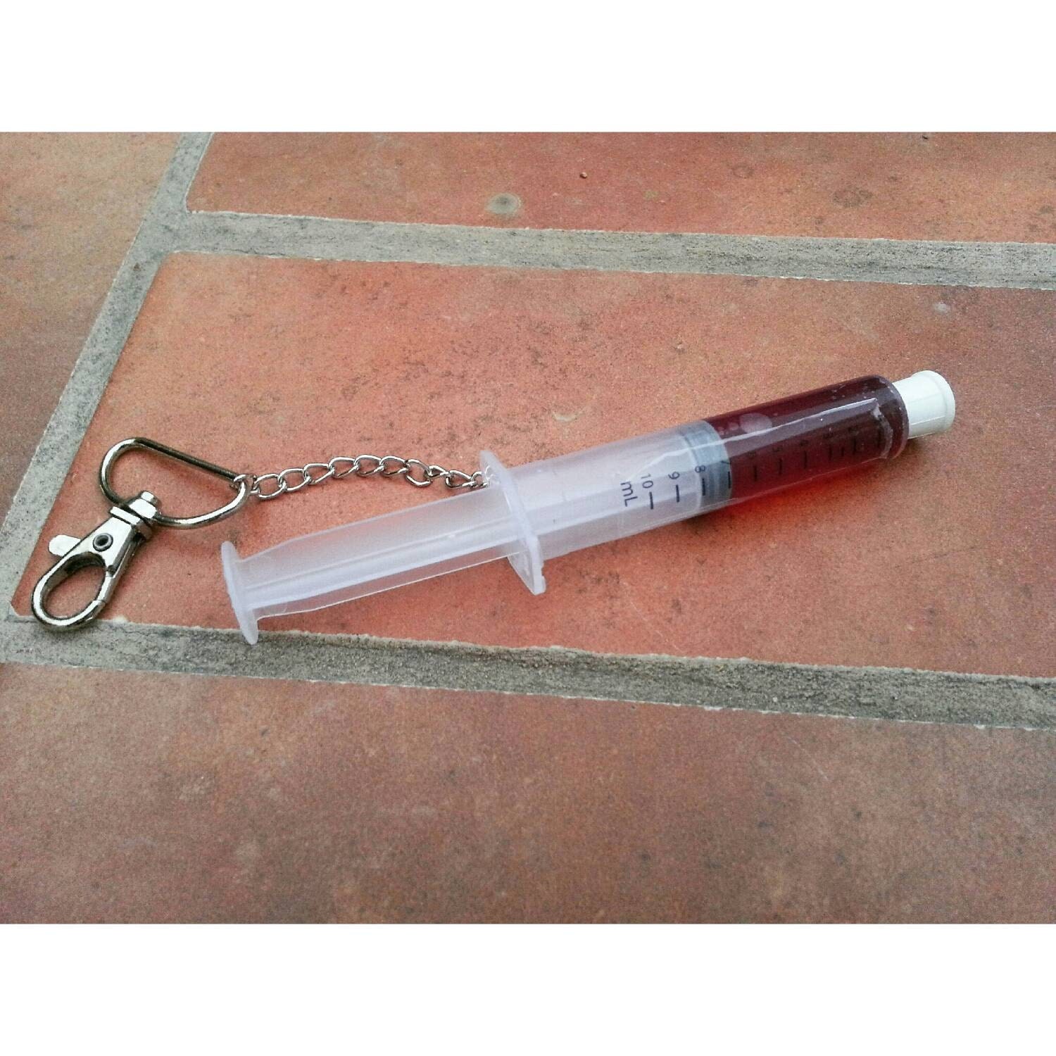 Plastic Syringe Keychain filled with Fake by GraveRaiderCreations
