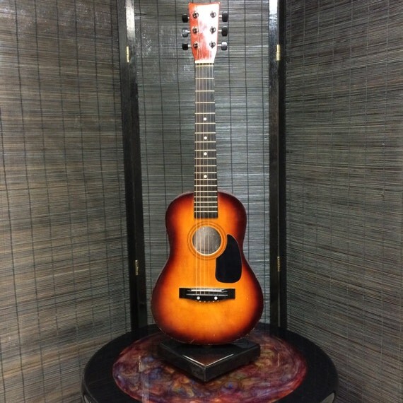 Table top guitar shelf.Rotates 360 degrees for a guitar with mirror on