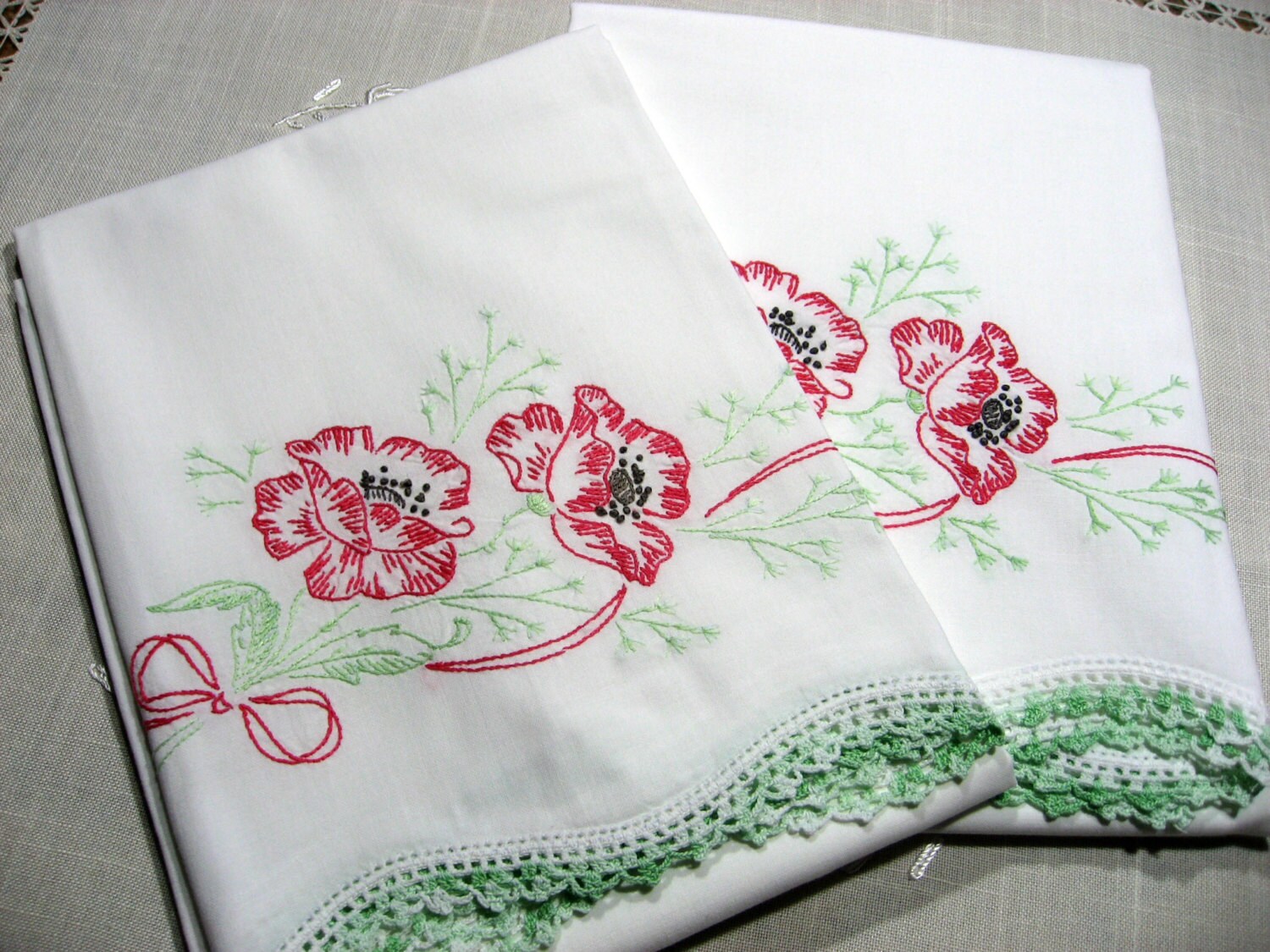 Vintage 1950s hand embroidered pillowcases. Red poppy with