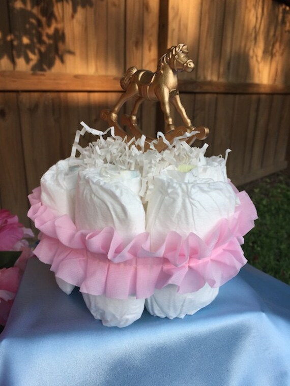 Gold Painted Rocking Horse Diaper Cake with Pink by onceuponevents