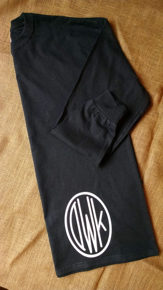 monogram on bottom of shirt