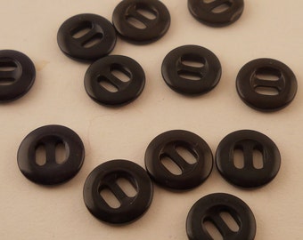 BUTTONS: 1 Dozen black buttons, 1/2 inch, 2 hole, small button.