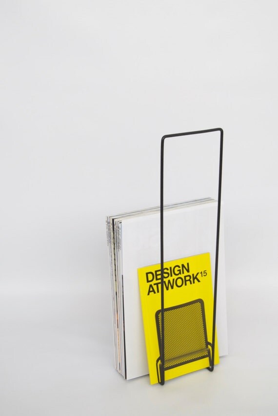 Metal magazine holder with a black wooden base by ADesignprojects