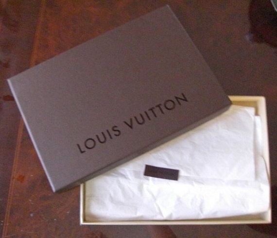 Vintage LOUIS VUITON box with original tissue and sticker.