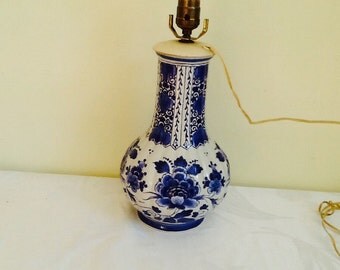 Vintage blue ware Delft lamp. Large vintage Delft porcelain blue and white lamp. In pristine condition with no cracks, nicks or crazing.