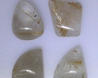 Four gold Rutile Quartz cabochons, various shapes and sizes, 89.08 carats