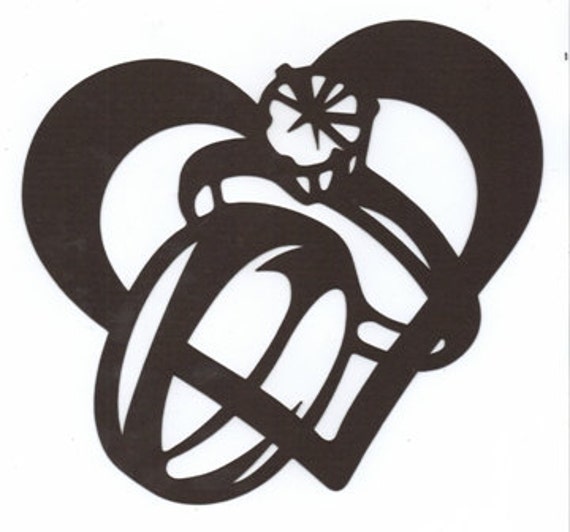  Wedding  rings  in heart silhouette 