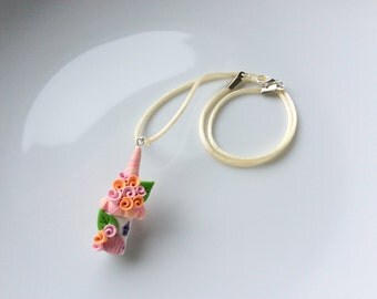 Fairy house necklace in pink and peach handmade from polymer clay