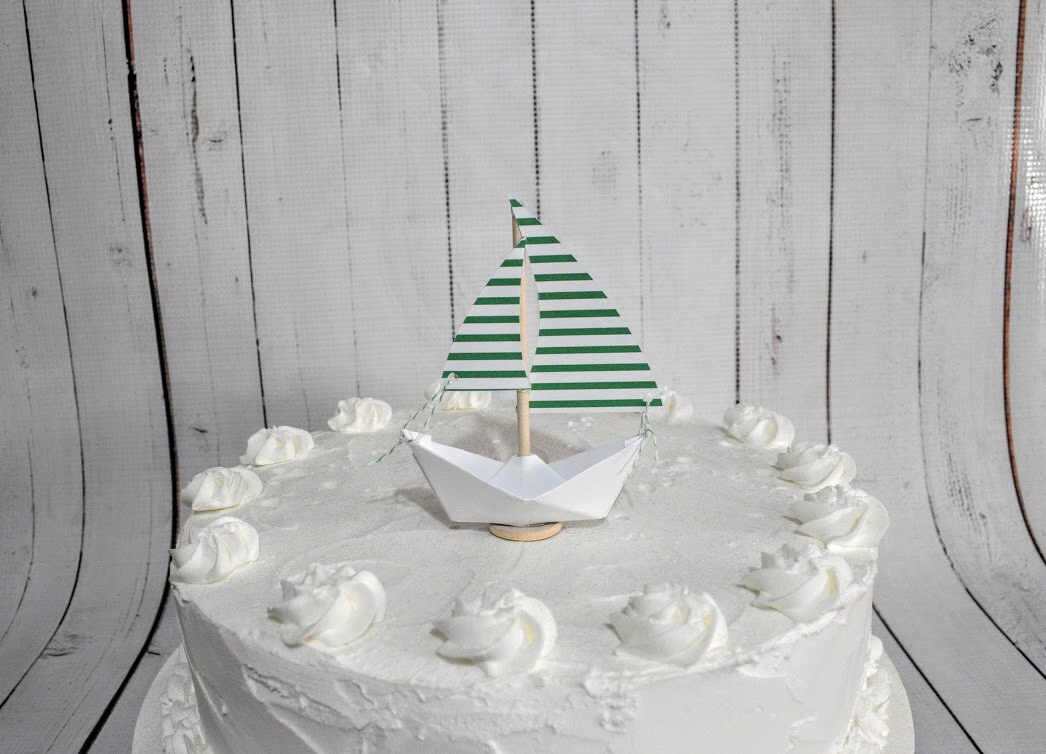 paper sailboat cake topper