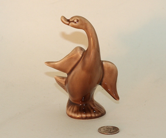 brown bird figurine