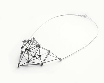 Geometric bib necklace of silver stainless steel Futuristika statement jewelry
