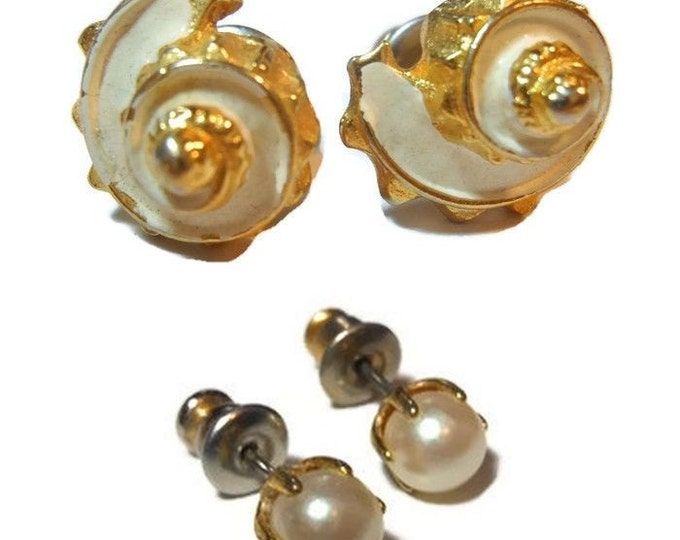 Two pair stud earrings, faux pearl in gold tone setting and gold with white enamel shell post earrings