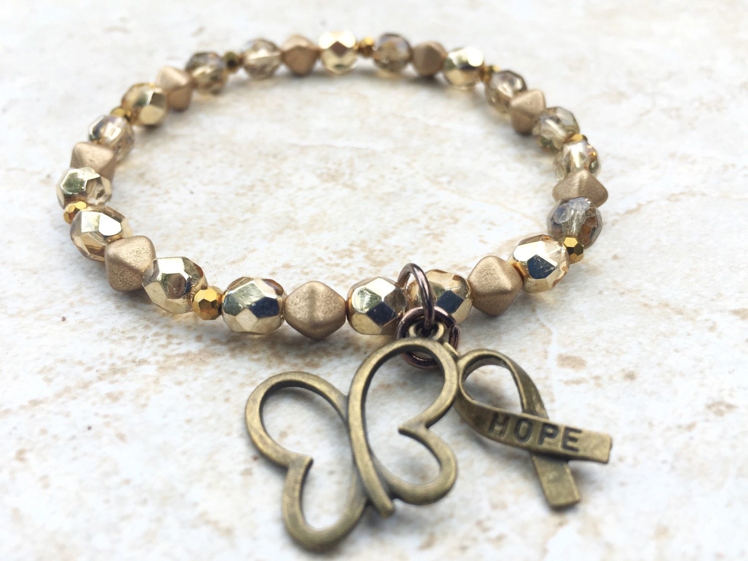 Gold childhood cancer awareness bracelet cancer support