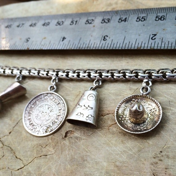 Antique Sterling Silver Charm Bracelet / by SusansEstateJewelry