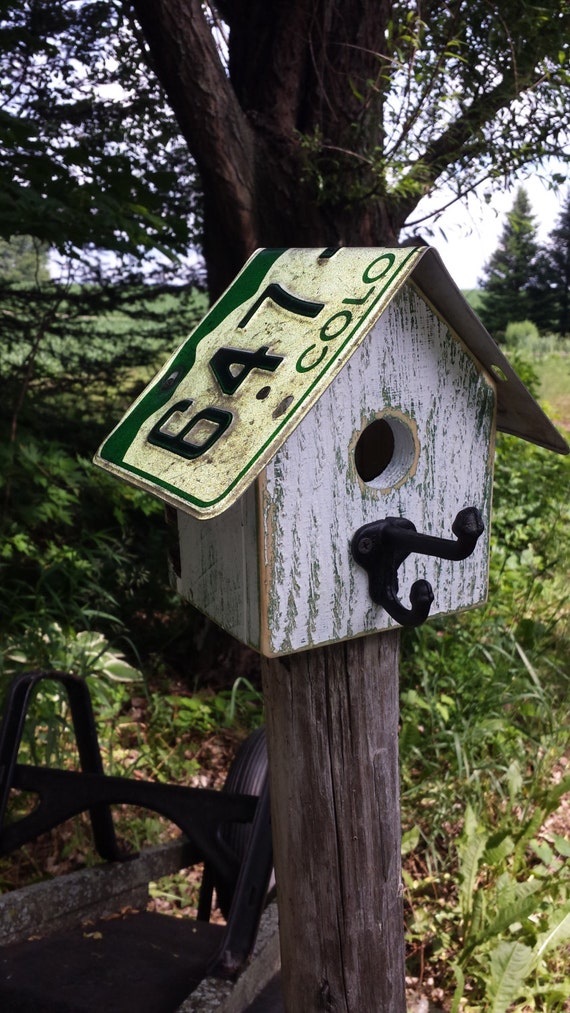 Colorado license plate roof on reclaimed wood birdhouse with