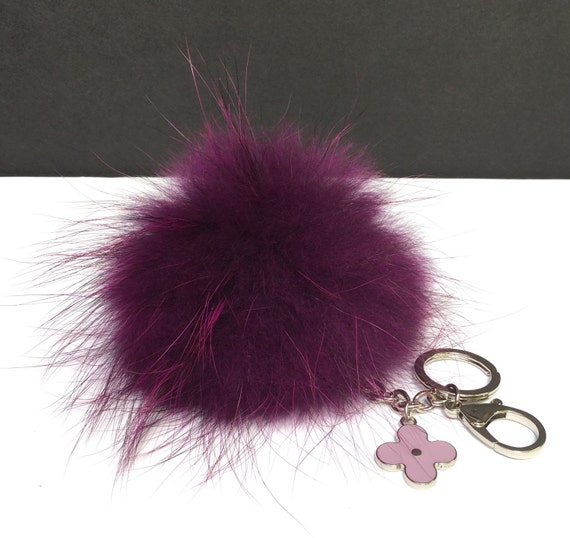 Items similar to Fur Pom Pom keychain luxury bag charm pendant clover