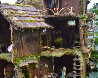 Print, 11" x 14" on canvas, "Fairy House in the Forest", house is made from branches, wood, moss, leaves, twigs and pods, 3' tall