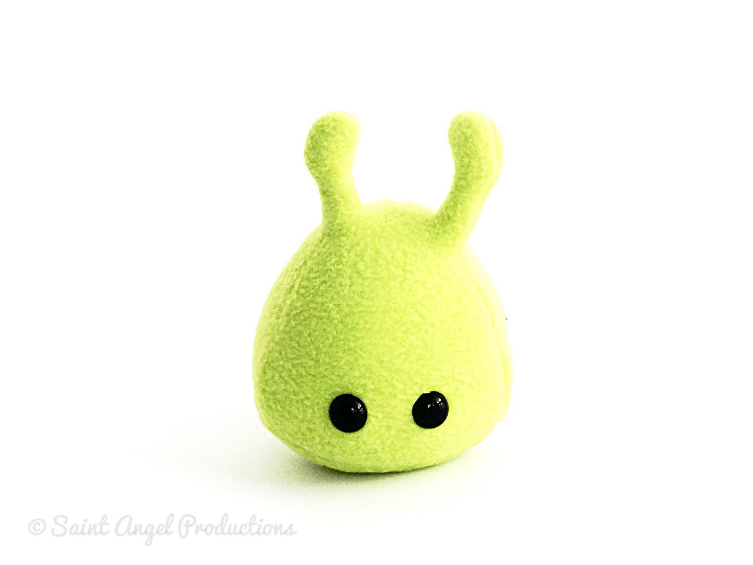 green alien plush toy