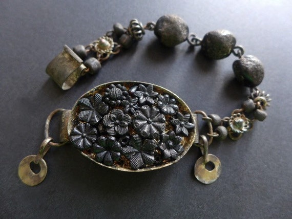 Night's teeth.  Rustic assemblage beaded bracelet in black with antique French carved jet flowers. 