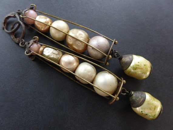 Luminous Moons. Caged baroque pearl earrings.