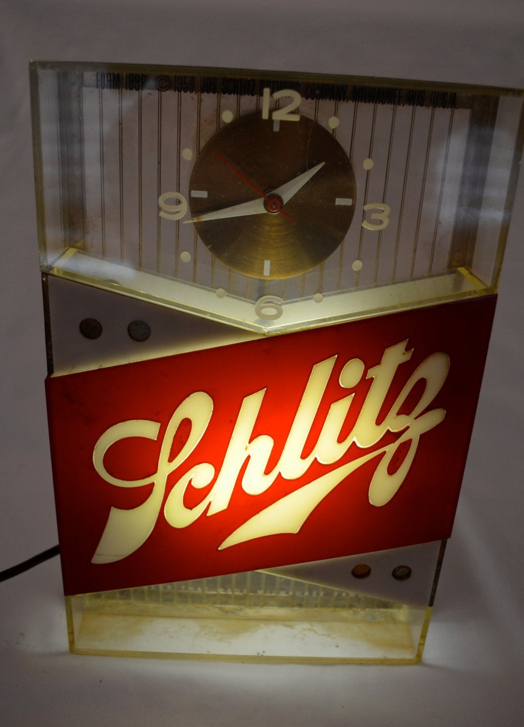 Vintage SCHLITZ BEER lighted bar clock sign dated 1959 works