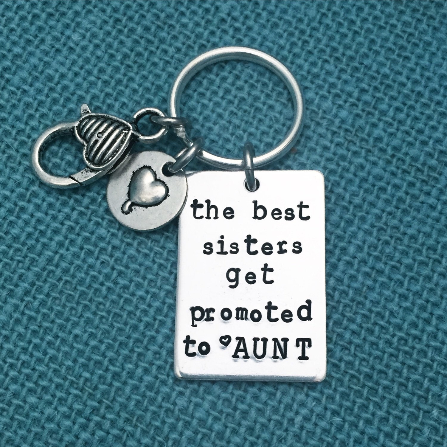 Keychain with clasp and charm The best sisters get promoted