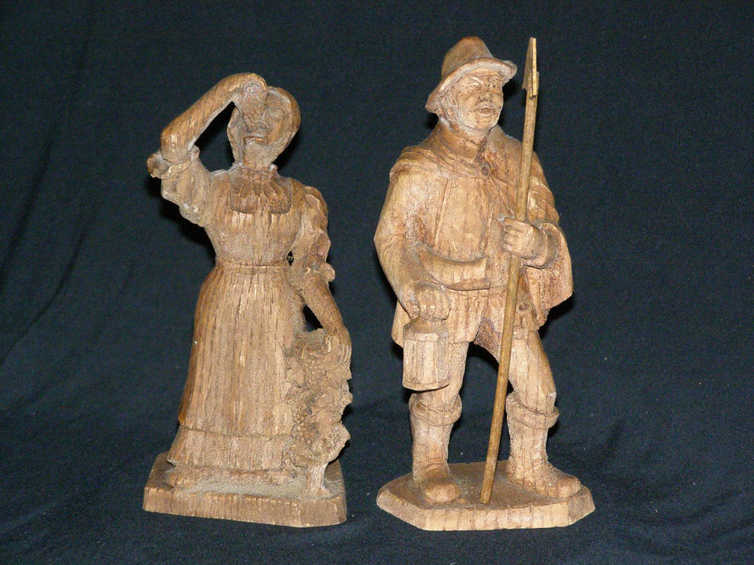 Vintage Two Hand Carved wood figurines. She's tending to