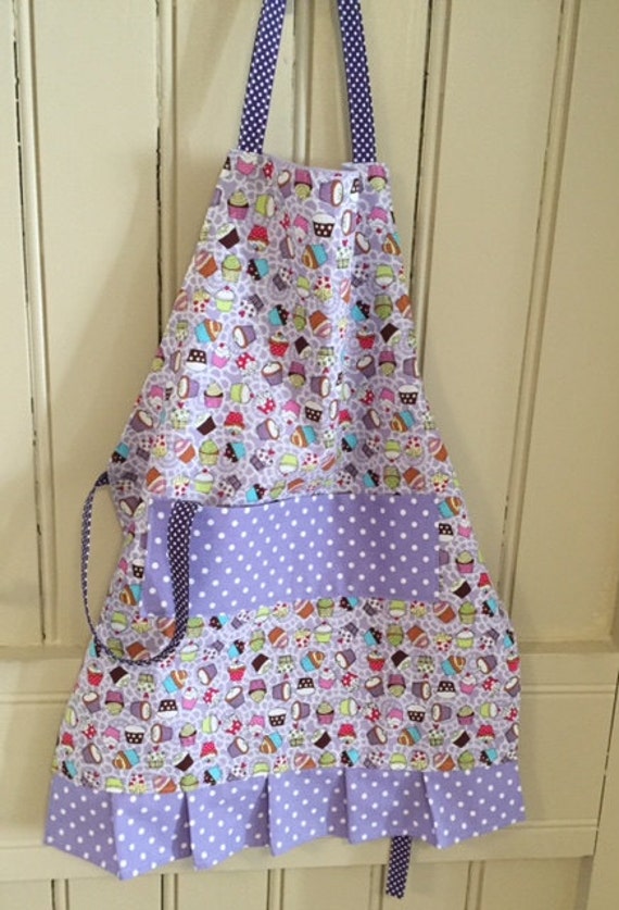 Handmade child's apron in lilac cupcakes fabric with pocket and fully lined