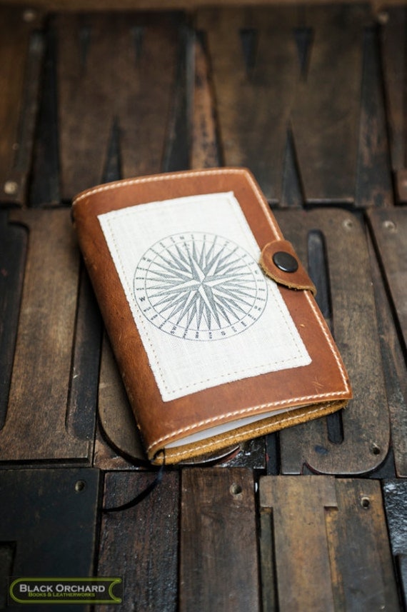 leather travel journal compass