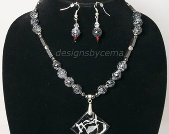 Necklace and earrings set with black diamond focal