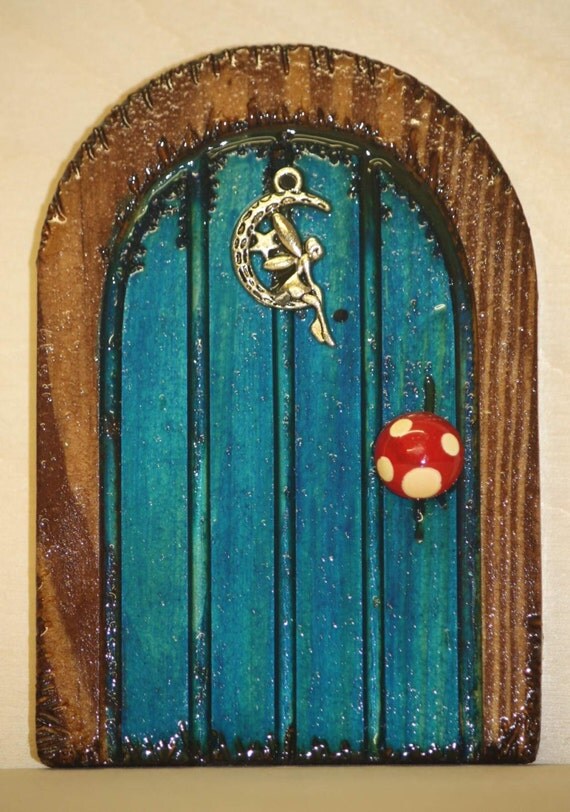 handmade turquoise wooden fairy door with fairy by 2wigglefish