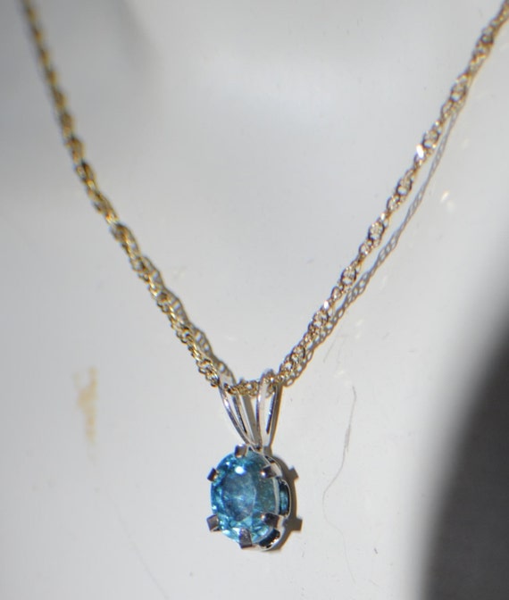 Dark Blue Zircon genuine gemstone 6x4mm oval in 10kt white