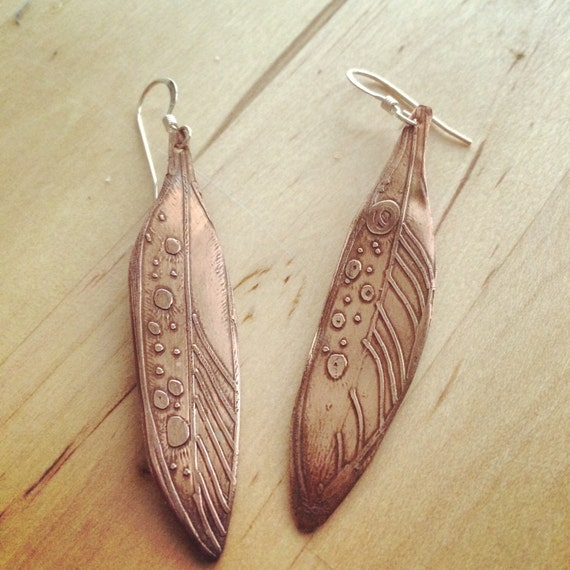 Items similar to AMOR Etched copper feather earrings with sterling ear