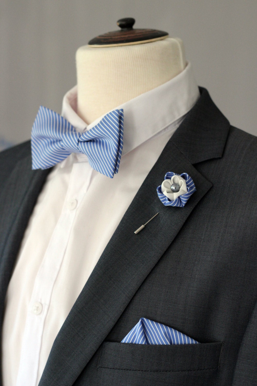 Blue pocket square and bow tie combinations with lapel flower