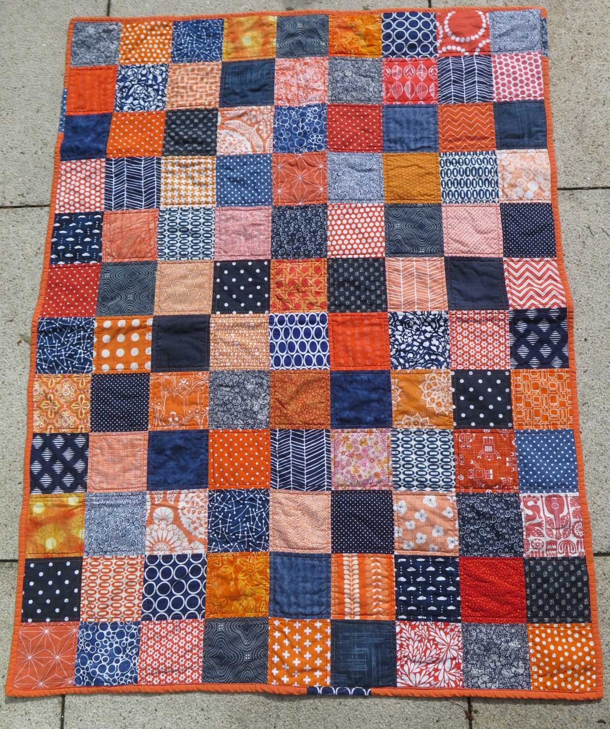 unisex-baby-quilt-in-orange-and-navy-orange-and-dark-blue