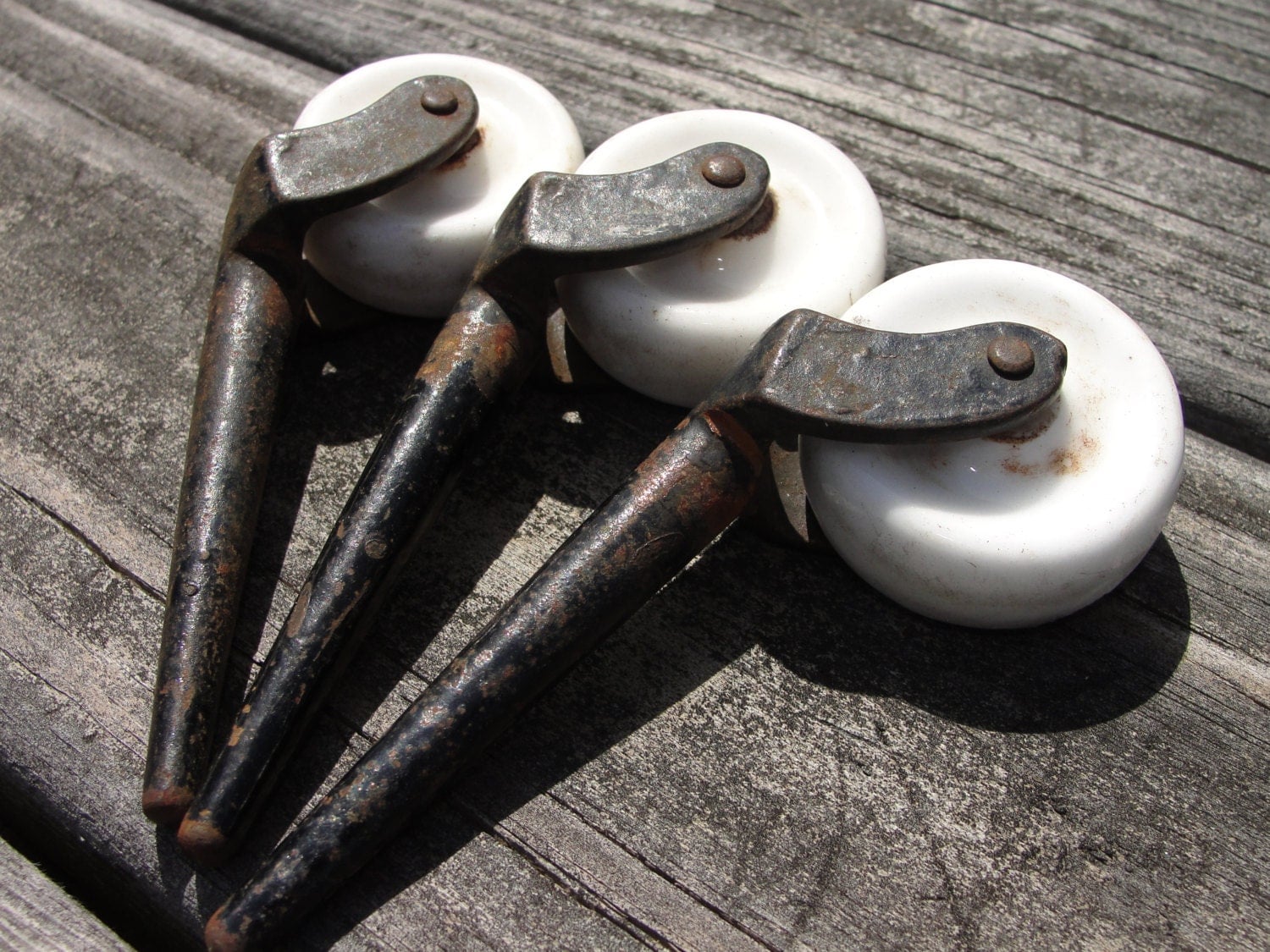 Antique porcelain and metal furniture casters set of three Haute Juice