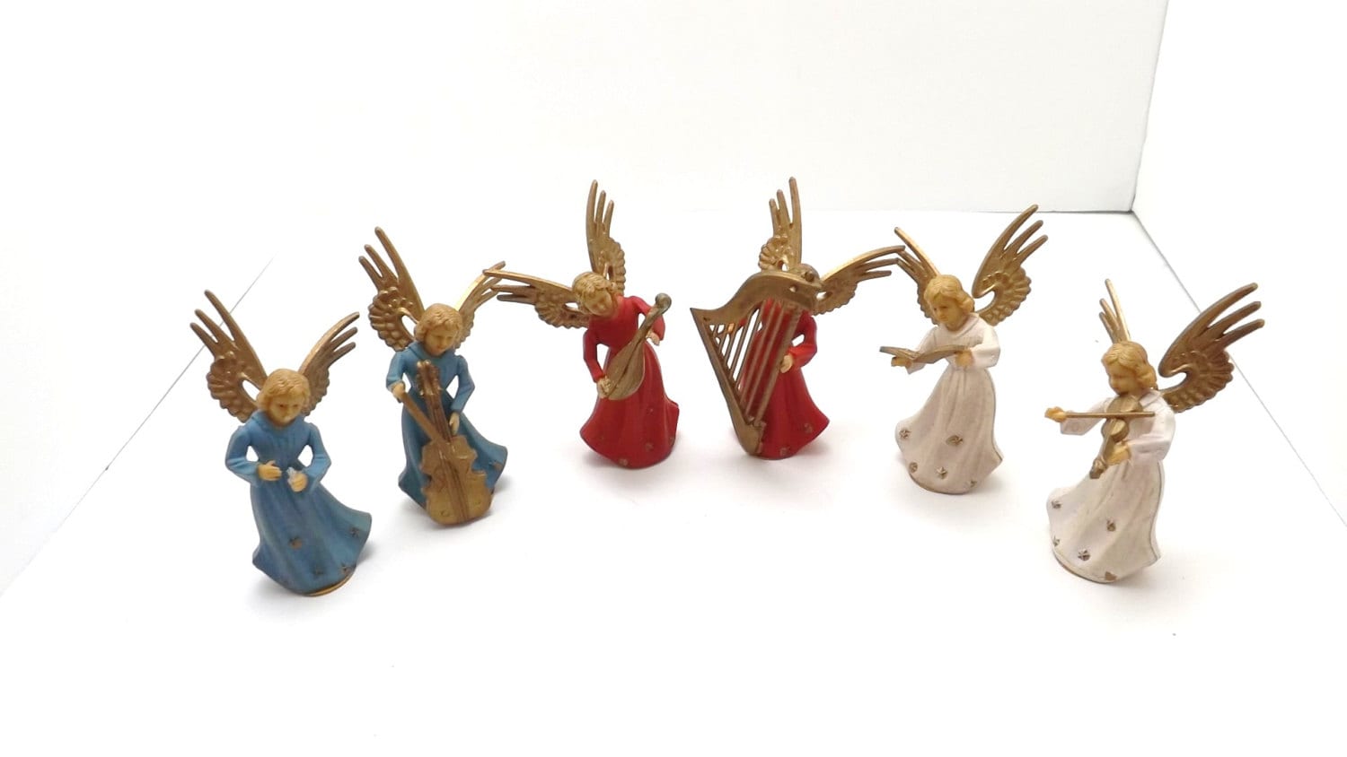 A set of 6 miniature plastic angels musical instruments hong