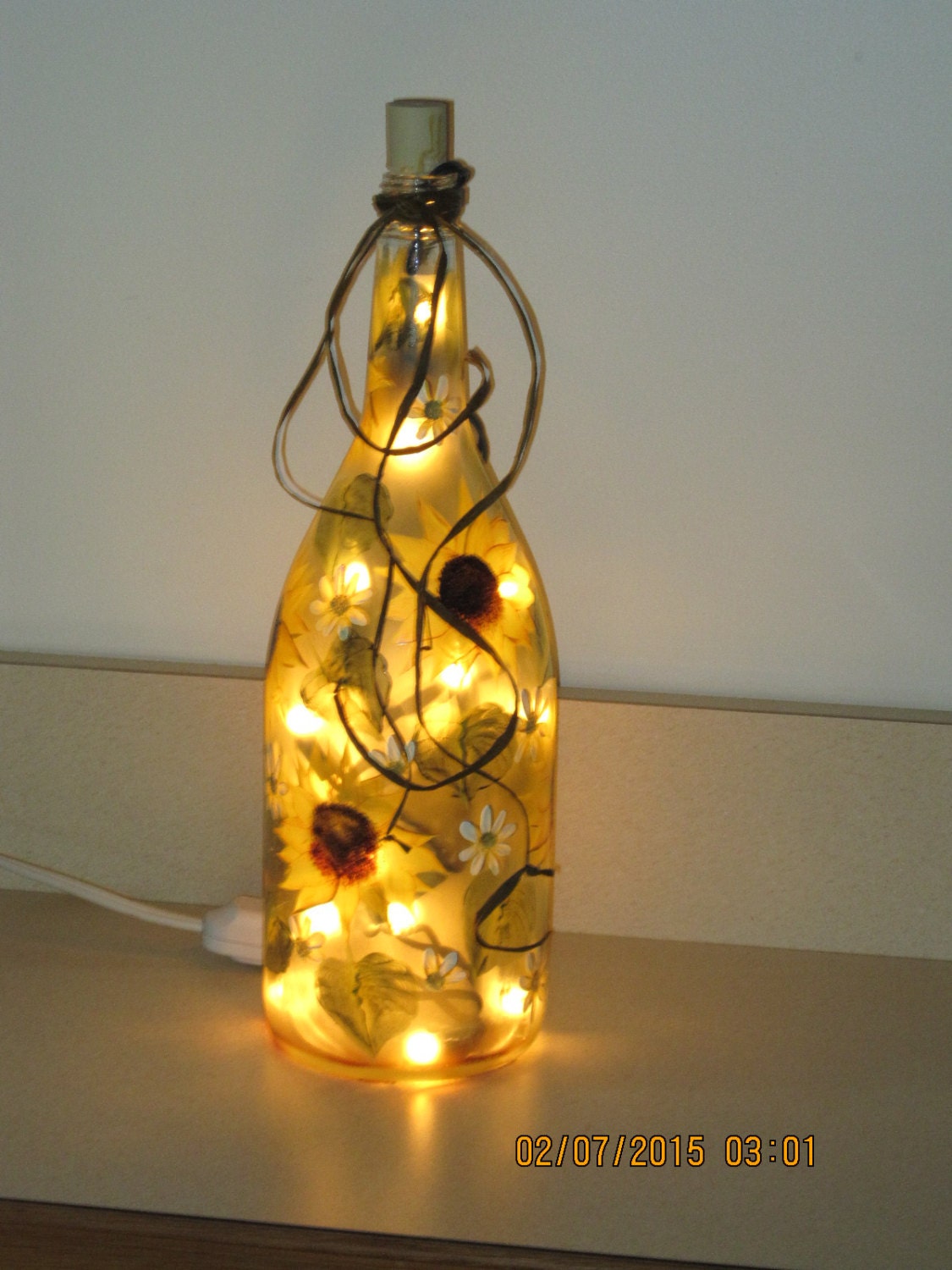 Wine bottle with lights hand painted with Sunflowers