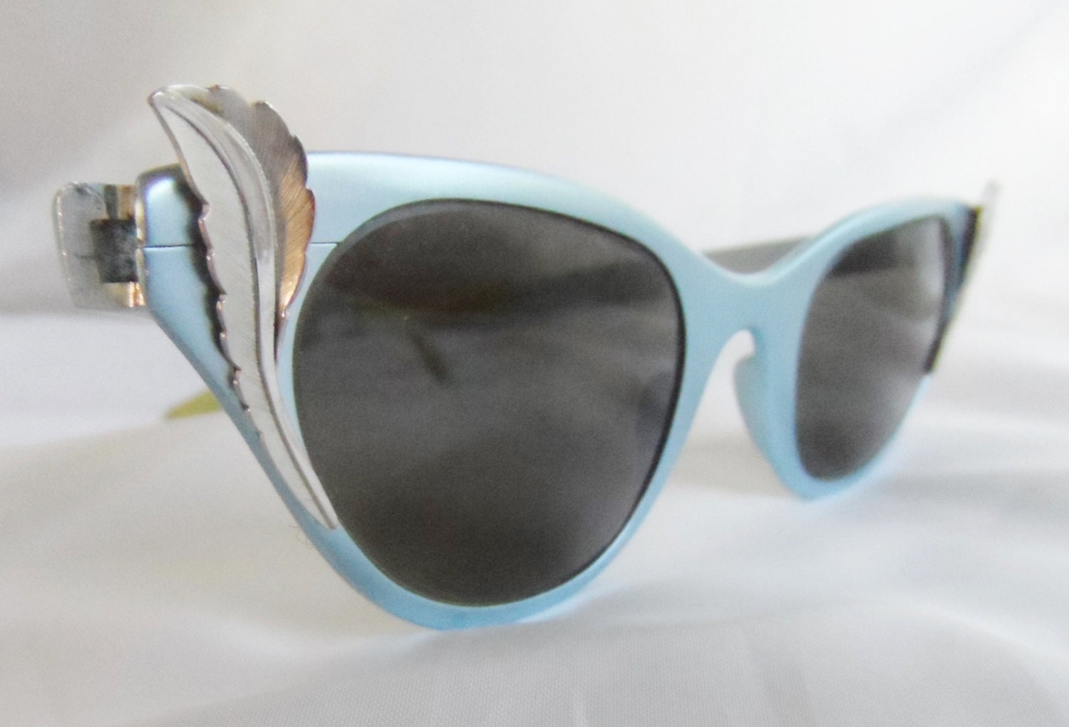 1950s Tura Cat Eye Sunglasses Powder Blue Aluminum With Silver Scroll Wings Haute Juice