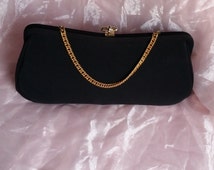 black purse with gold accents