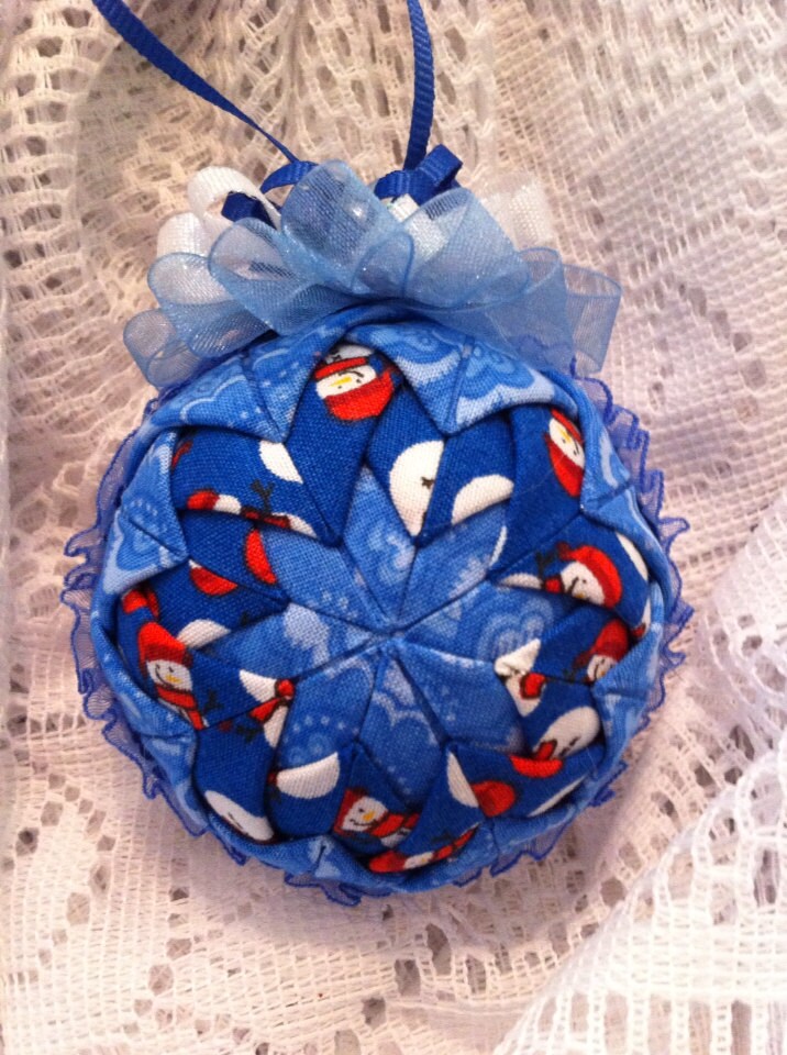 Blue fabric folded star ball decoration.