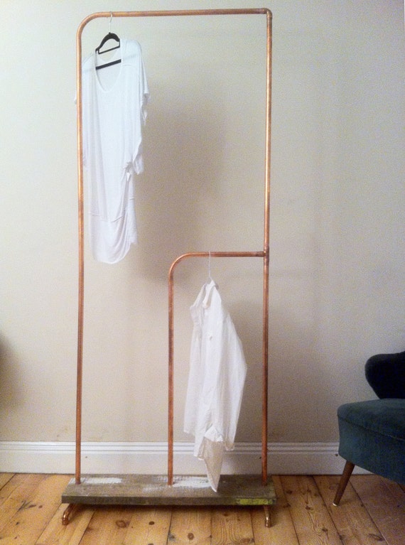 Built to spec copper clothes rail with scaffold plank base.